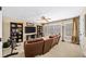 Spacious entertainment room featuring a home gym, large TV, bookshelves, and comfortable leather seating at 2358 New Salem Trce, Marietta, GA 30064