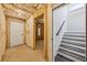 Unfinished basement with exposed insulation and framing, complemented by stairs leading to the finished upper level at , Atlanta, GA 30310