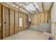 Unfinished basement showcasing bare stud walls and a water heater, ready for customization and potential living space at , Atlanta, GA 30310