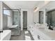 Modern bathroom with double vanity, a freestanding tub, and a glass-enclosed shower at , Atlanta, GA 30310