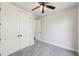 Bedroom with double closets, carpet floors, ceiling fan, and white trim at , Atlanta, GA 30310