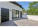 Outdoor patio featuring a door into the interior, black fixtures, and concrete flooring at , Atlanta, GA 30310