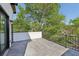Outdoor patio with black metal railing overlooking a leafy landscape at , Atlanta, GA 30310