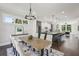 Open-concept dining room leading into a kitchen with an expansive island and barstool seating at , Atlanta, GA 30310
