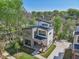 Aerial view of a modern home featuring sharp angles, expansive windows, and lush greenery creating a private oasis at , Atlanta, GA 30310