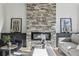 Close up of a stone fireplace with modern decor, built-in shelving, and a cozy ambiance at , Atlanta, GA 30310