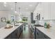 Well-lit kitchen with a large island, modern appliances, and stylish gray and white cabinetry at , Atlanta, GA 30310