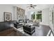 Bright living room featuring a stone fireplace, hardwood floors, and a large window showcasing outdoor views at , Atlanta, GA 30310