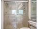 Modern bathroom with glass-enclosed shower featuring neutral tile and updated fixtures at 200 Renaissance Ne Pkwy # 219, Atlanta, GA 30308