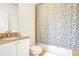 Well-lit bathroom featuring a vanity with granite countertop and a shower-tub combination at 200 Renaissance Ne Pkwy # 219, Atlanta, GA 30308