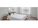 Comfortable bedroom featuring a large window, neutral walls, and a stylish side table at 200 Renaissance Ne Pkwy # 219, Atlanta, GA 30308