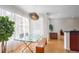 Bright dining area with glass table, modern lighting, and seamless transition to living space at 200 Renaissance Ne Pkwy # 219, Atlanta, GA 30308