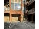 Brick apartment building featuring multiple garages and balconies with beautiful flower boxes at 200 Renaissance Ne Pkwy # 219, Atlanta, GA 30308