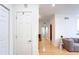Hallway featuring hardwood floors and seamless transition to the living area at 200 Renaissance Ne Pkwy # 219, Atlanta, GA 30308