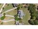 Aerial view showcases the home's large lot, driveway and patio area in a lush setting at 2032 Grovewood Ct, Cumming, GA 30041