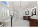 Bright bathroom features a soaking tub, glass shower, and double vanity with dark wood cabinets at 2032 Grovewood Ct, Cumming, GA 30041