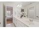 Bright bathroom with double sink and white cabinetry at 2032 Grovewood Ct, Cumming, GA 30041
