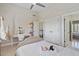 Bright bedroom with hanging chair and view to hall at 2032 Grovewood Ct, Cumming, GA 30041