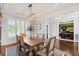 Elegant dining room featuring a wooden table, stylish chairs, modern chandelier, and sophisticated decor at 2032 Grovewood Ct, Cumming, GA 30041