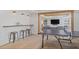 Basement game room features a ping pong table, wet bar, and lounge space at 2032 Grovewood Ct, Cumming, GA 30041