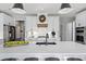 Contemporary kitchen features a large center island, stainless steel appliances, and sleek white cabinets at 2032 Grovewood Ct, Cumming, GA 30041