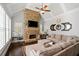 Cozy living room with stone fireplace, vaulted ceiling, and comfortable seating, perfect for relaxing and entertaining at 2032 Grovewood Ct, Cumming, GA 30041