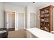 Bright office space with built-in bookcase and storage, desk, and ample closet space at 2032 Grovewood Ct, Cumming, GA 30041