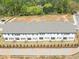 Aerial view of townhomes featuring back patios and landscaping at 2413 Malster Ln, Lawrenceville, GA 30043