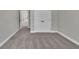A bedroom featuring neutral carpet, white trim, and a double-door closet provides ample storage space at 2413 Malster Ln, Lawrenceville, GA 30043