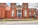 Exterior of Bobby Sikes building with a brick facade, columns, and manicured landscaping at 2413 Malster Ln, Lawrenceville, GA 30043