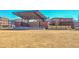Community lawn area with an outdoor event space for gatherings in a residential neighborhood with nearby shopping and dining at 2413 Malster Ln, Lawrenceville, GA 30043
