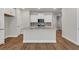 Open concept kitchen featuring granite countertops, center island, and stainless appliances at 2413 Malster Ln, Lawrenceville, GA 30043