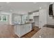 Open concept kitchen with granite countertops, stainless steel appliances and island at 2413 Malster Ln, Lawrenceville, GA 30043