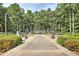 View of a memorial with manicured landscaping, flags, benches, and a central walkway at 2413 Malster Ln, Lawrenceville, GA 30043