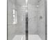 Modern shower with glass door and marble-look tile for a luxurious feel at 2413 Malster Ln, Lawrenceville, GA 30043