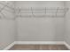 Walk-in closet with carpet and metal shelving at 2413 Malster Ln, Lawrenceville, GA 30043