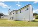 Exterior shot of a home showing a backyard with a lawn, patio, and white siding at 3791 Plantation Mill Dr, Buford, GA 30519