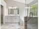 Spa-like bathroom features dual vanities, soaking tub, and glass-enclosed shower at 3791 Plantation Mill Dr, Buford, GA 30519