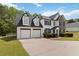 Inviting two-story home with a spacious driveway, two-car garage, and well-maintained landscaping at 3791 Plantation Mill Dr, Buford, GA 30519