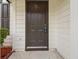 Close-up of a solid front door providing security and curb appeal to this lovely home at 3791 Plantation Mill Dr, Buford, GA 30519
