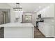 Bright kitchen features white cabinets, stainless steel appliances, and quartz countertops at 3791 Plantation Mill Dr, Buford, GA 30519