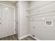 Functional laundry room features shelving and washer/dryer hookups at 3791 Plantation Mill Dr, Buford, GA 30519