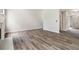 Inviting living room with hardwood floors and ample space for furniture, perfect for entertaining and relaxing at 3791 Plantation Mill Dr, Buford, GA 30519