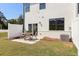 Backyard patio with outdoor seating and a well-maintained lawn area at 1022 Sutherland Lane (Lot 42), Lawrenceville, GA 30043