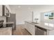 Modern kitchen with stainless steel appliances, granite countertops, and a kitchen island at 1022 Sutherland Lane (Lot 42), Lawrenceville, GA 30043