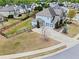 Aerial view of the property showing a fenced backyard, three-car garage, and well-maintained lawn at 331 Spotted Ridge Cir, Woodstock, GA 30188