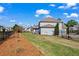 A spacious backyard with a patio set, enclosed by a black fence, offers a private outdoor retreat at 331 Spotted Ridge Cir, Woodstock, GA 30188