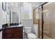 Full bathroom featuring a glass enclosed shower, modern toilet and fixtures, and dark cabinets at 331 Spotted Ridge Cir, Woodstock, GA 30188