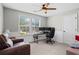 This bedroom is set up as an office with large windows, desk, and leather recliner at 331 Spotted Ridge Cir, Woodstock, GA 30188