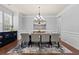 Elegant dining room with hardwood floors, chandelier, and neutral décor perfect for entertaining at 331 Spotted Ridge Cir, Woodstock, GA 30188